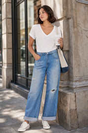 Jean bleu moyen jambe large taille repliée | Photo lifestyle | Lounelle Paris