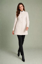 Manteau mi-long à col montant | Vue en mouvement | Lounelle Paris