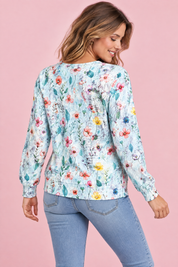 Cardigan bleu clair boutonné à col rond | Vue de dos | Lounelle Paris
