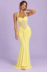 Long yellow fitted dress with halter neckline and ruching