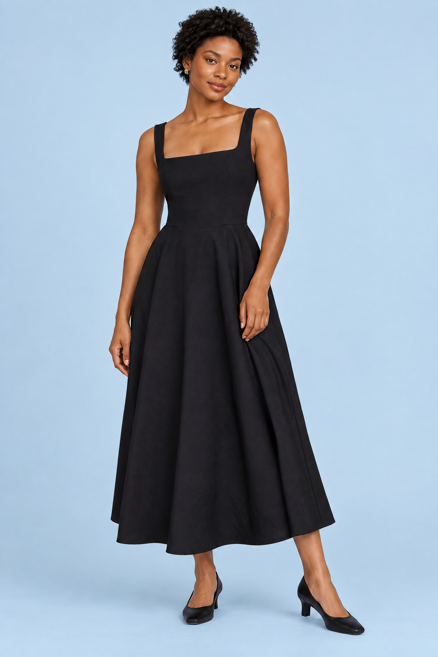 Robe midi noire à fines bretelles et ourlet ample | Vue de face | Lounelle Paris