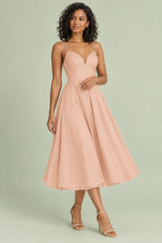 Robe midi beige à fines bretelles et jupe ample | Vue de face | Lounelle Paris