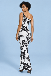 Robe longue noire à imprimé floral, coupe asymétrique et détail torsadé | Vue de dos | Lounelle Paris