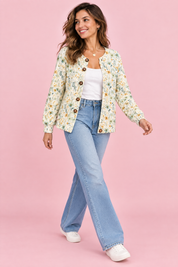 Cardigan fleuri boutonné blanc cassé | Vue en mouvement | Lounelle Paris