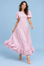 Robe longue rose à manches bouffantes et volant | Vue en mouvement | Lounelle Paris