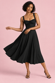 Robe midi noire à coupe trapèze et encolure carrée | Vue en mouvement | Lounelle Paris
